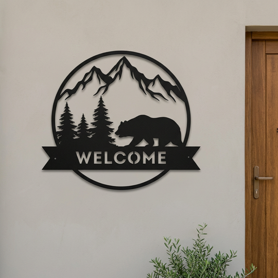 Bear Welcome sign on a quiet cabin entry wall